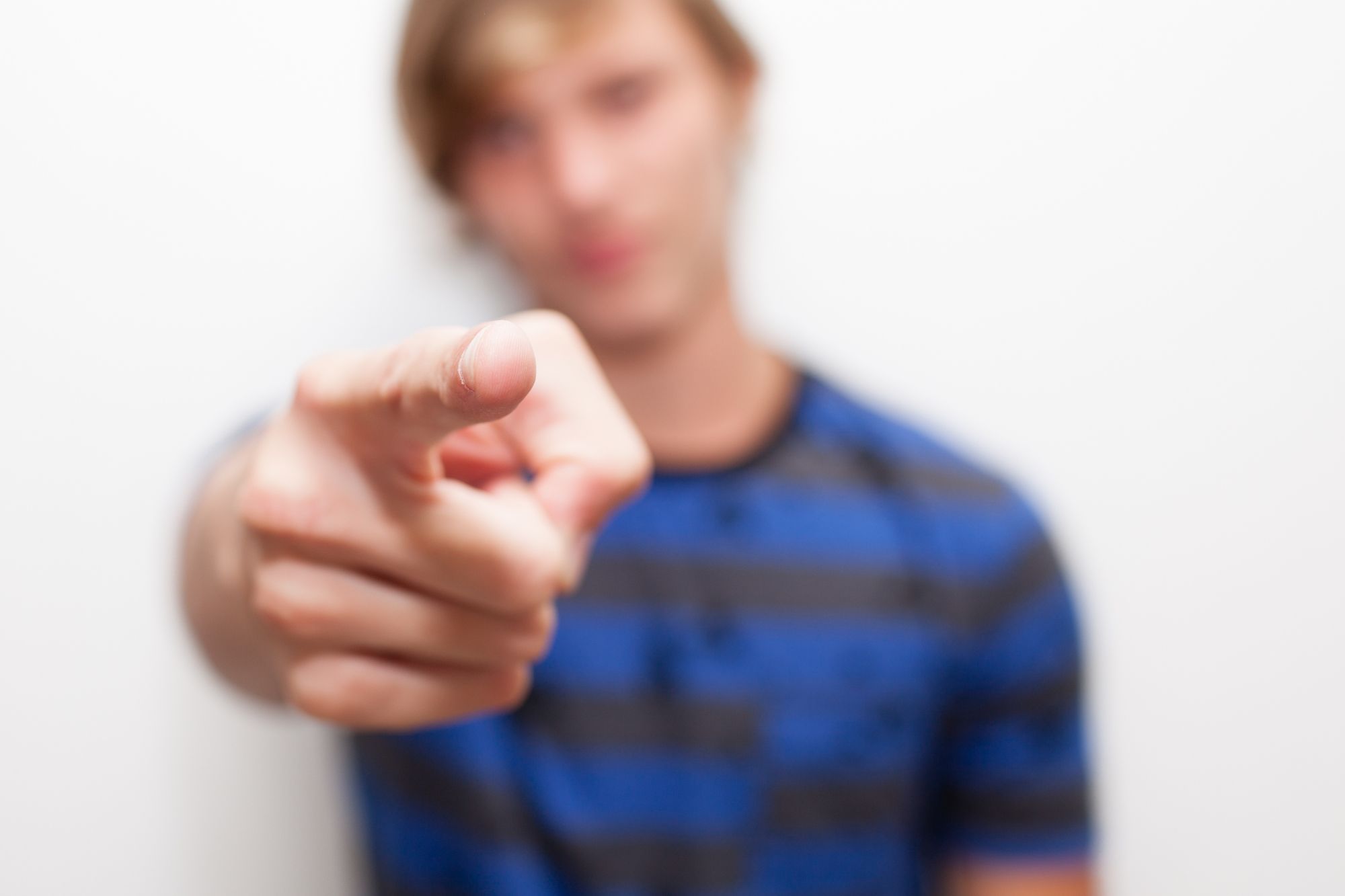 Man in blue points at reader to remind them to stop blaming your ex and you'll start getting over your divorce.