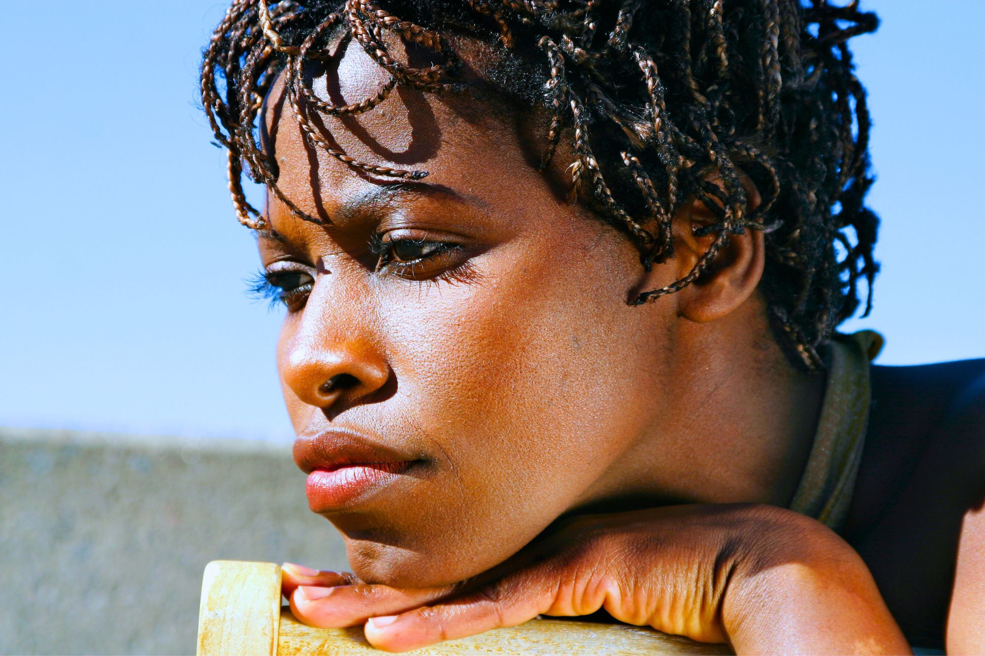Close up of a sad woman of color considering the tips you must know for successfully coping with divorce