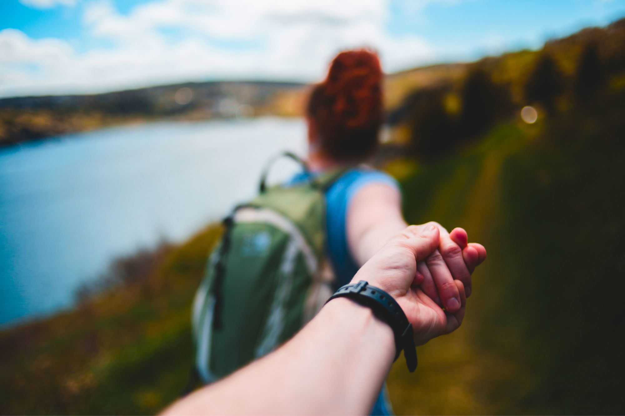 Couple holding hands as they embark on their adventures dating after divorce.