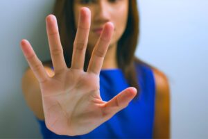 Woman with one arm outstretched asking "How to heal from Divorce? Stop Doing this."