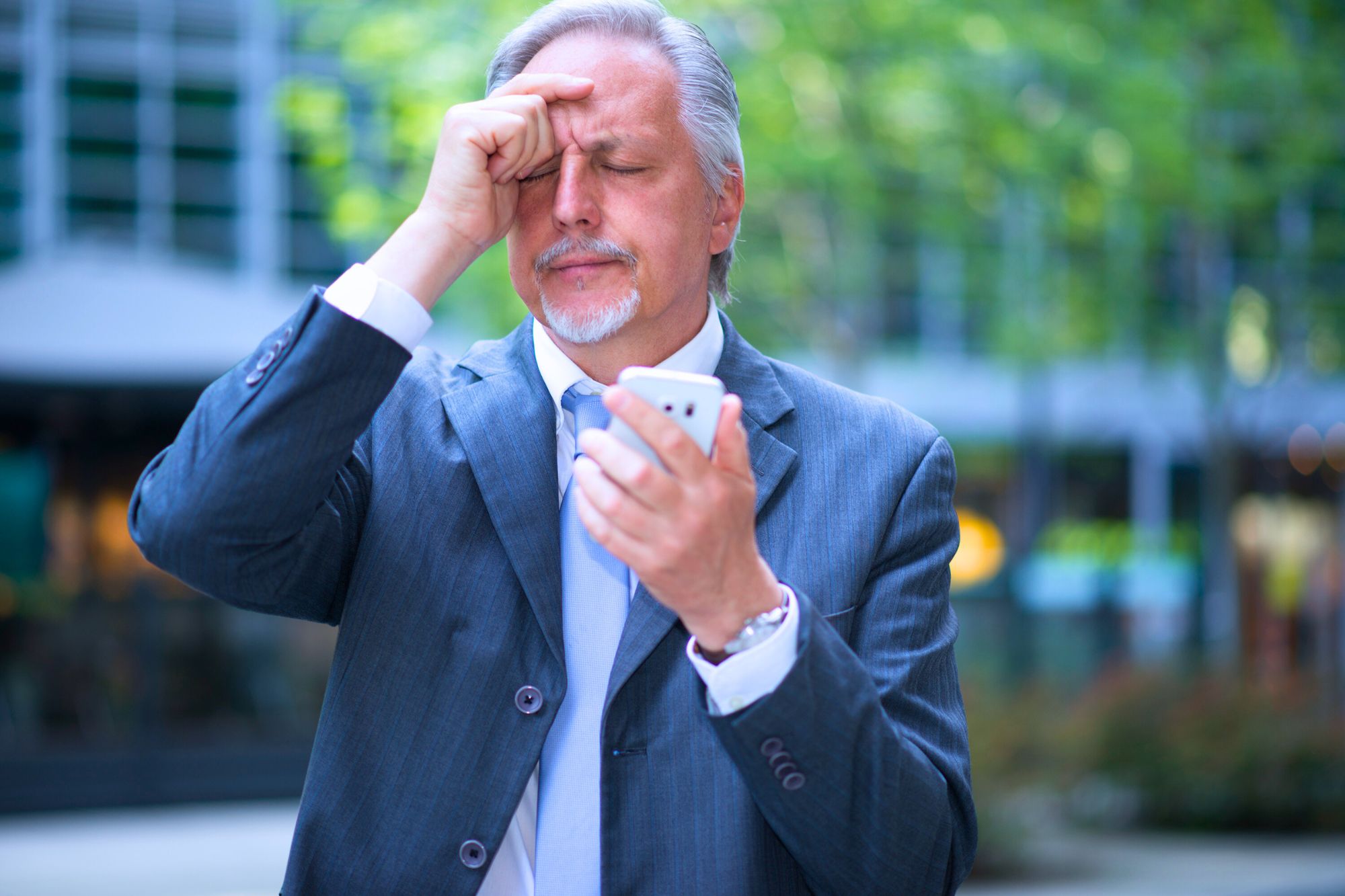 Frustrated man in suit figuring out what life after divorce for men over forty is really like.