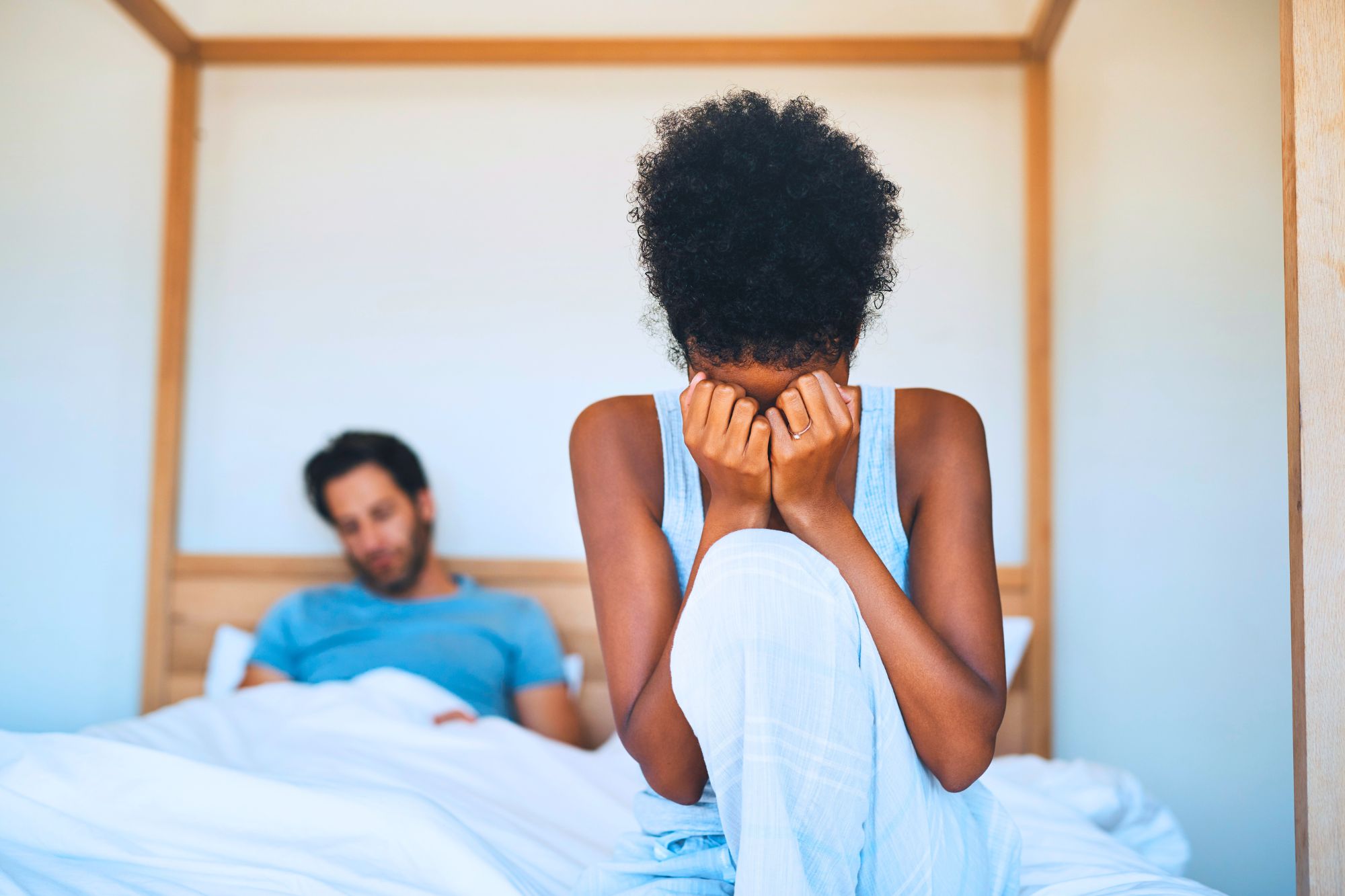 Woman struggling with the painful question, “Can I survive infidelity?”