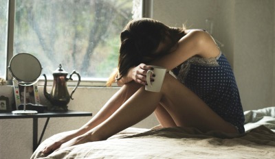 Sad woman wondering how to get over an unwanted divorce. Sad woman wondering how to get over an unwanted divorce.