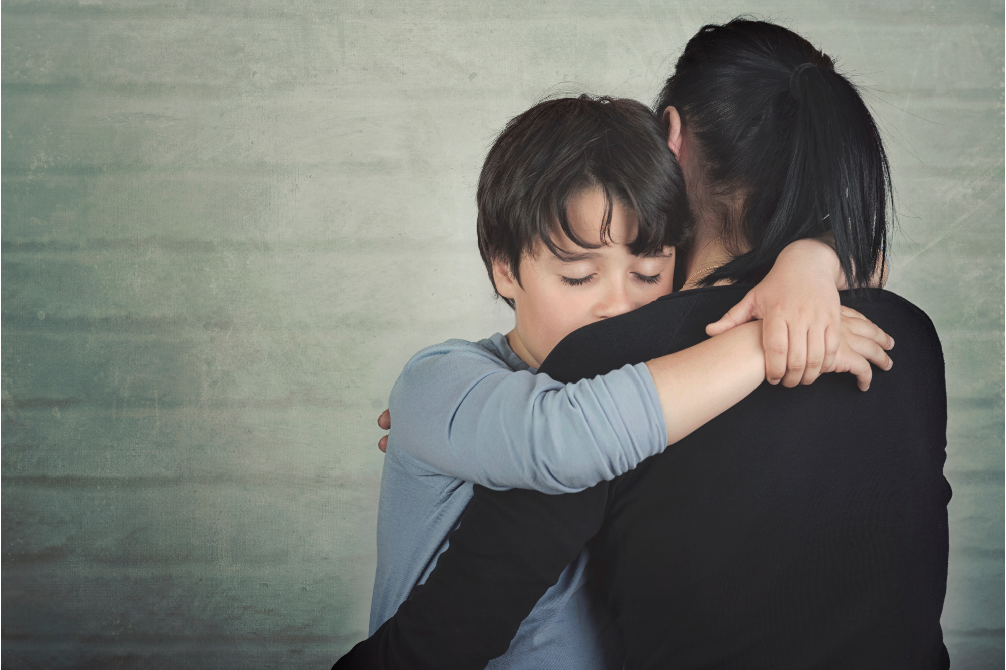 Mother hugs her son as she plans how to win custody of him against her narcissistic ex. Mother hugs her son as she plans how to win custody of him against her narcissistic ex.